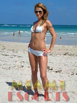 Miami top escorts love to pose on the beach.