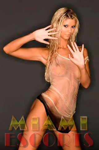 Blonde who offers escort services Miami Beach shows off in a wet outfit.